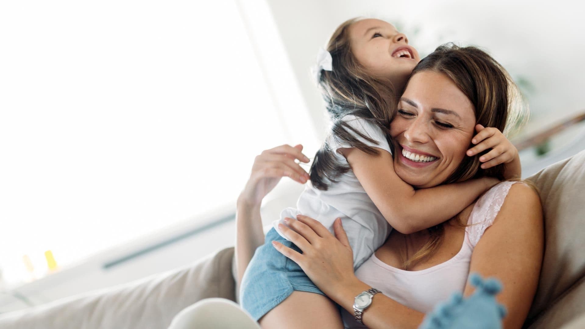 Daughter and Mom hugging